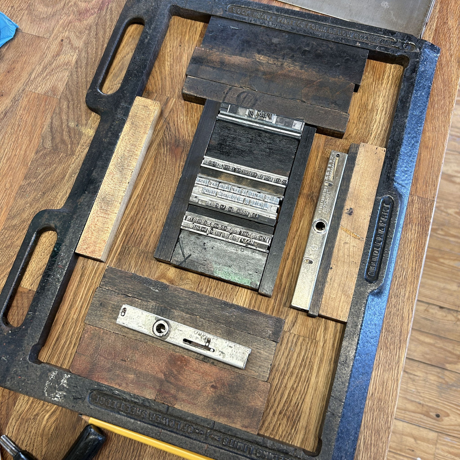 prepping the design to go into the press - with wood “furniture” for the white spaces!
