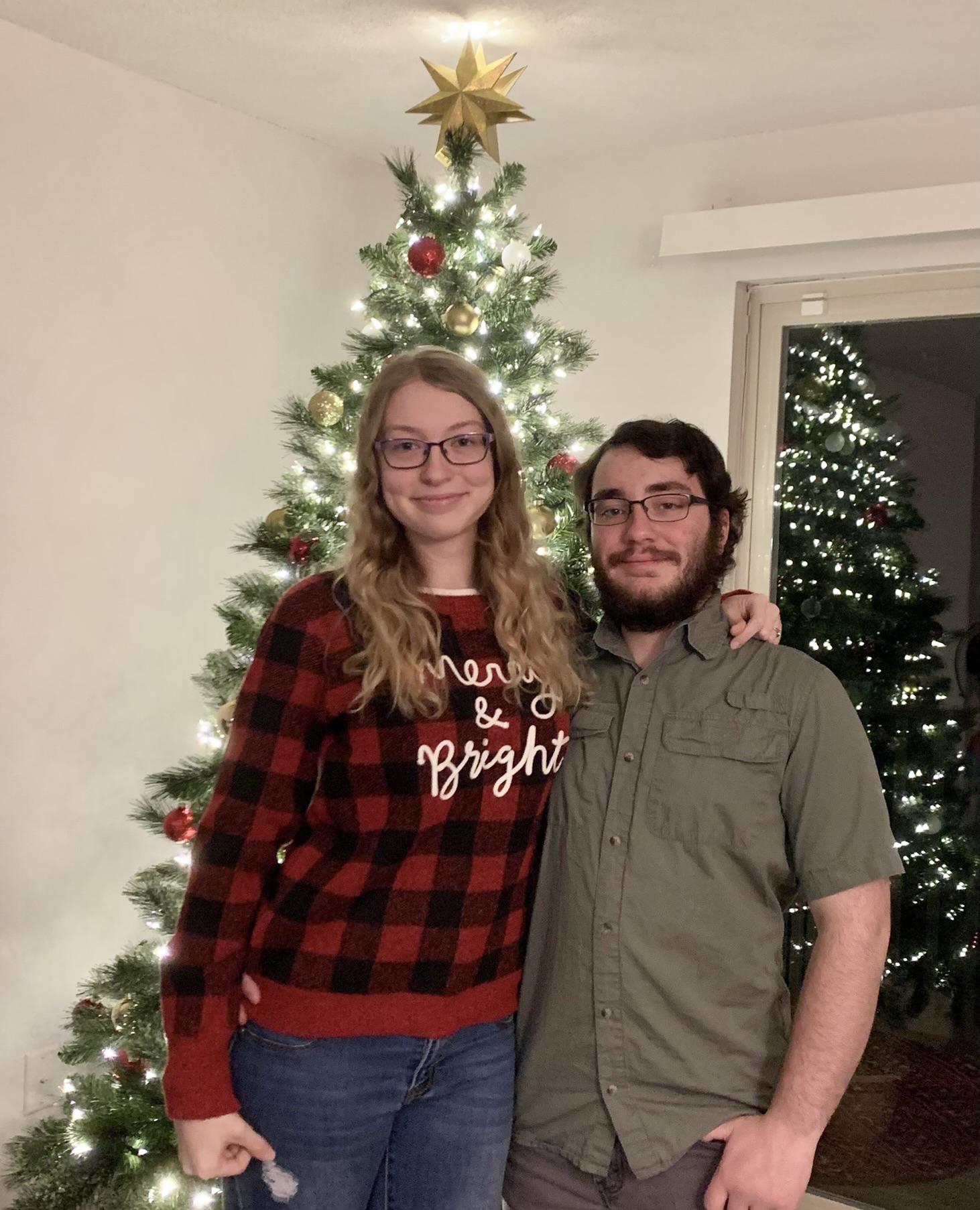 December 4th, 2021: Leah forced Conner to take this picture so they could send out their first set of Christmas cards after getting an apartment together.