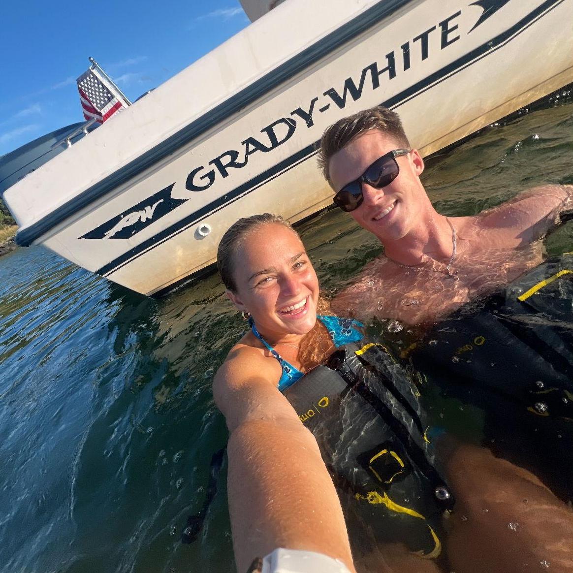 July 2024: Out on the boat in Boston Harbor, one of our favorite ways to spend time together!