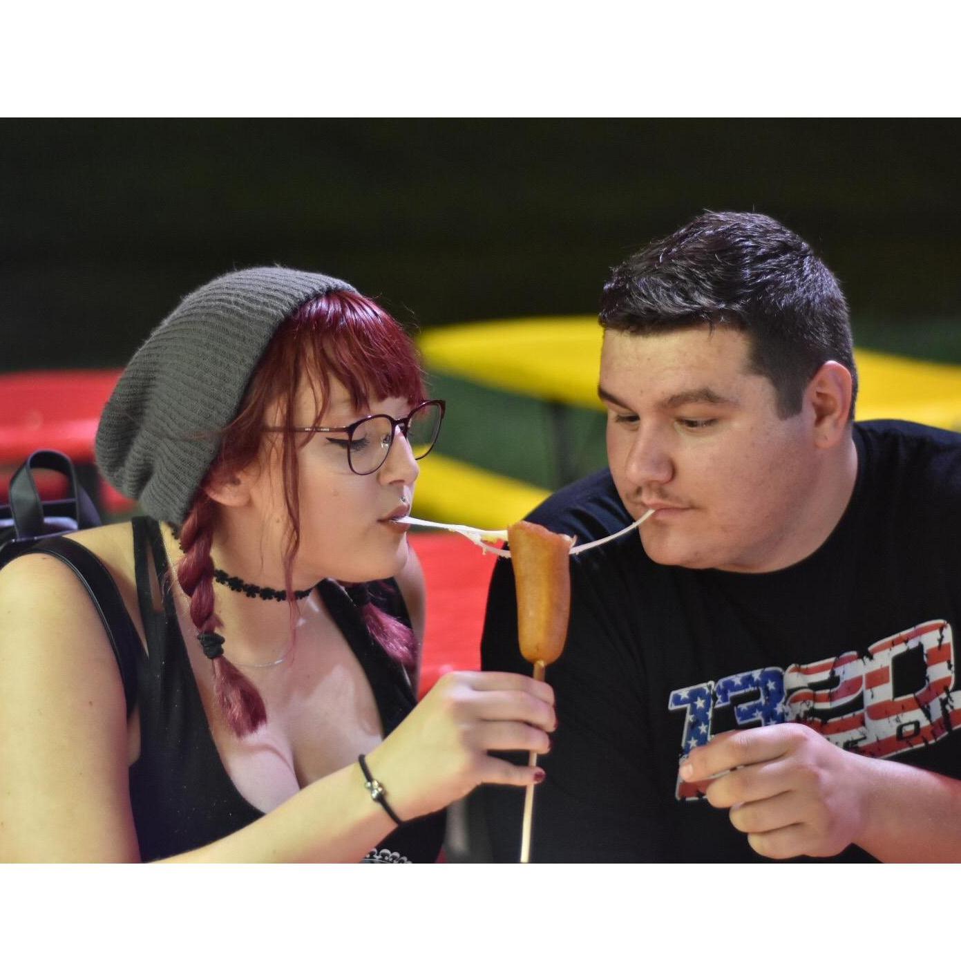 Candid moment of us sharing a cheese stick at the fair,
Moment captured by Taylor Rufty