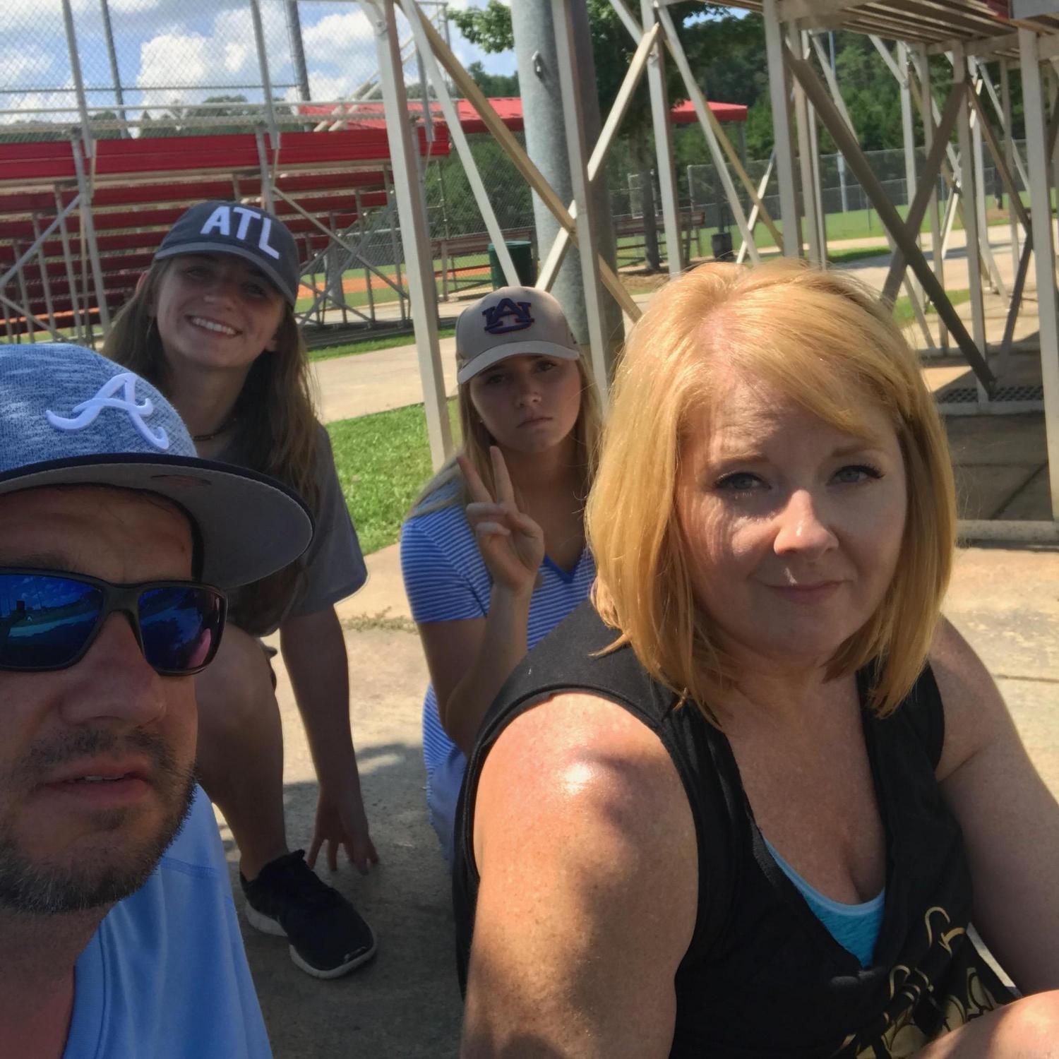 These girls came to cheer on Nolan on a hot Sunday afternoon.