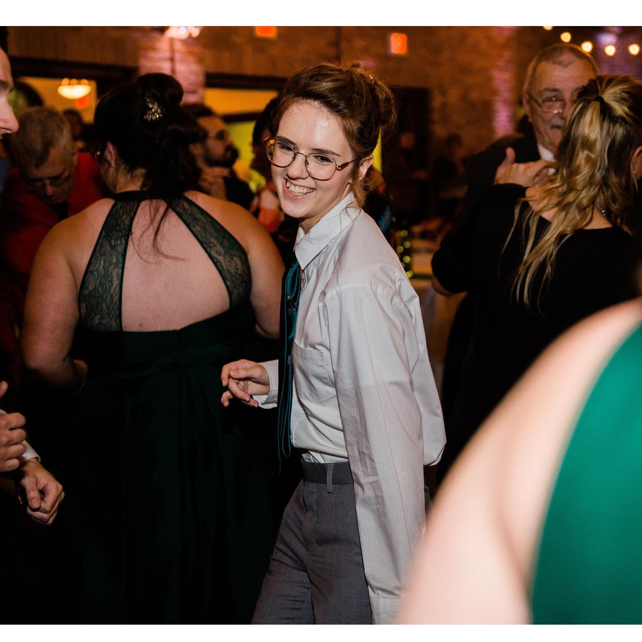 Melody tearing up the dancefloor at Monica and Logan's wedding.