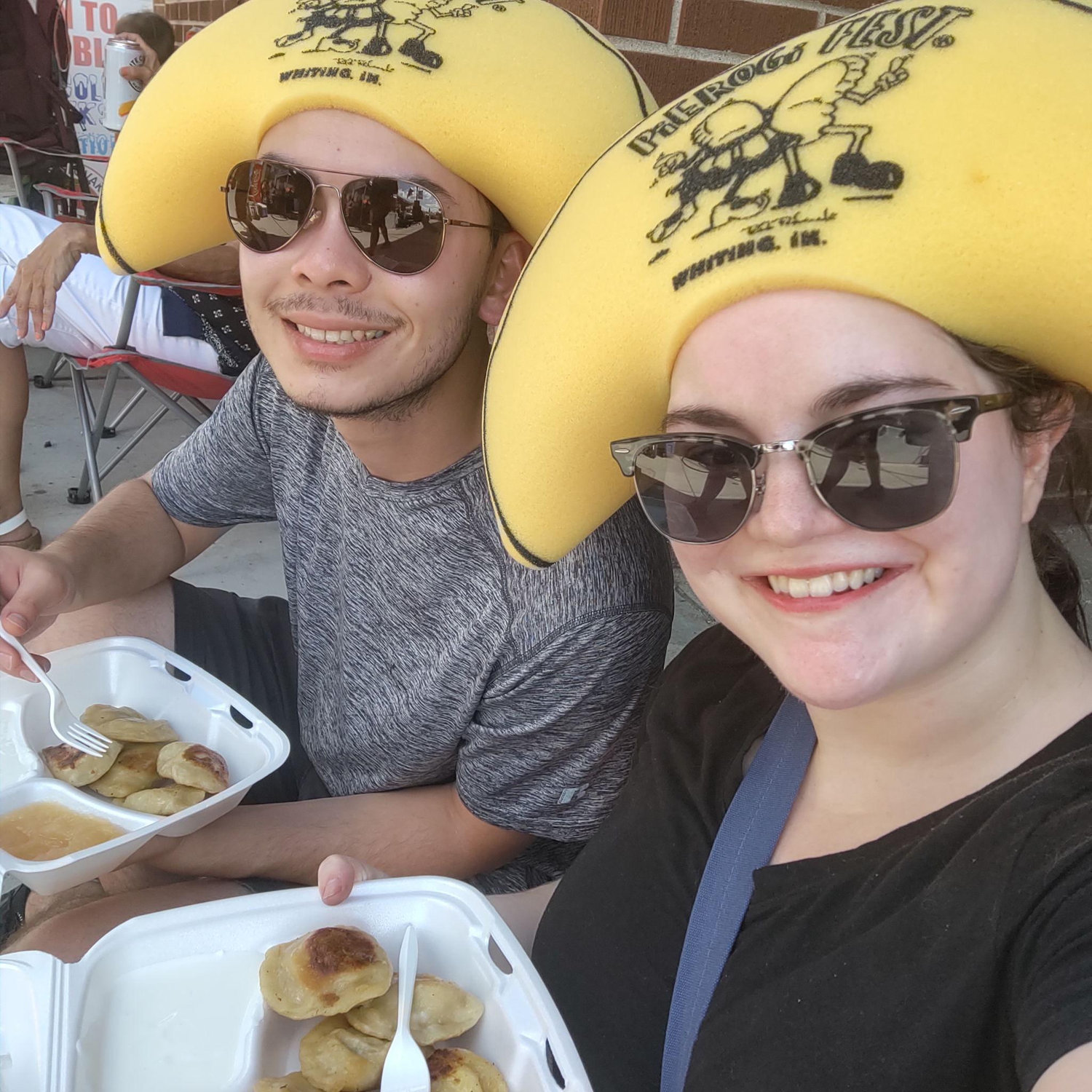 Eating pierogis at Pierogi fest in pierogi hats