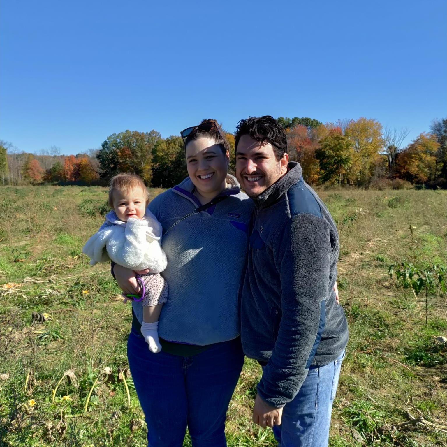 Pumpkin picking in the fall with Abby's youngest niece Violet at McCray's Farm in South Hadley, MA in October 2021.
