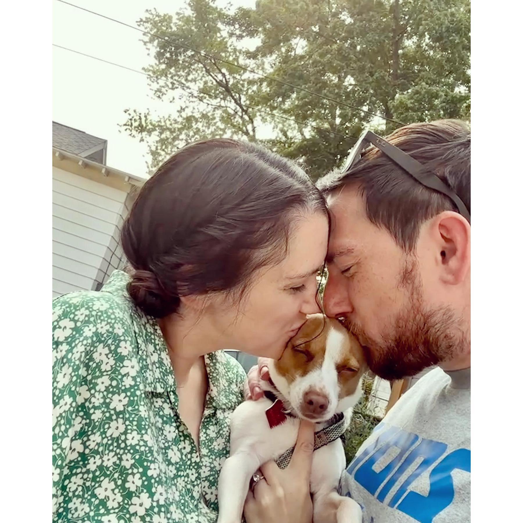 Loving on our dog, Dolly Pawton, the real head of our household.