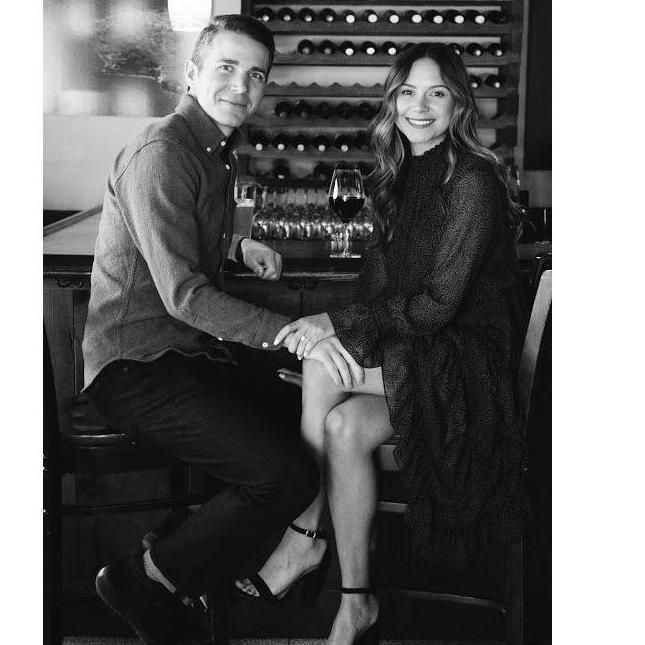 An engagement photo in our favorite bar.