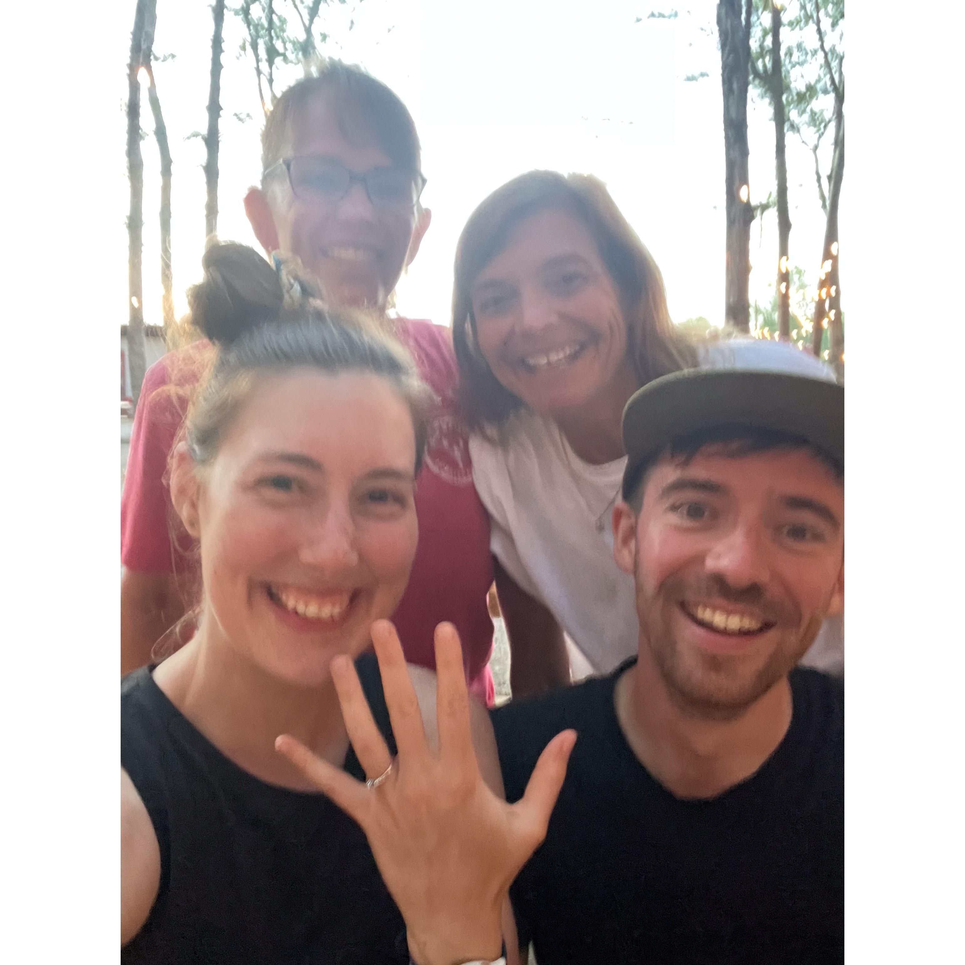 Celebrating with the lobster rolls people in Maine after we got engaged in 2023