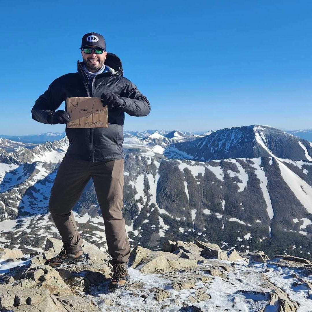 Chad on top of Mount Lincoln in CO- 2025. He was the best climbing partner to T this day as her then undiagnosed knee issue was getting the best of her!
