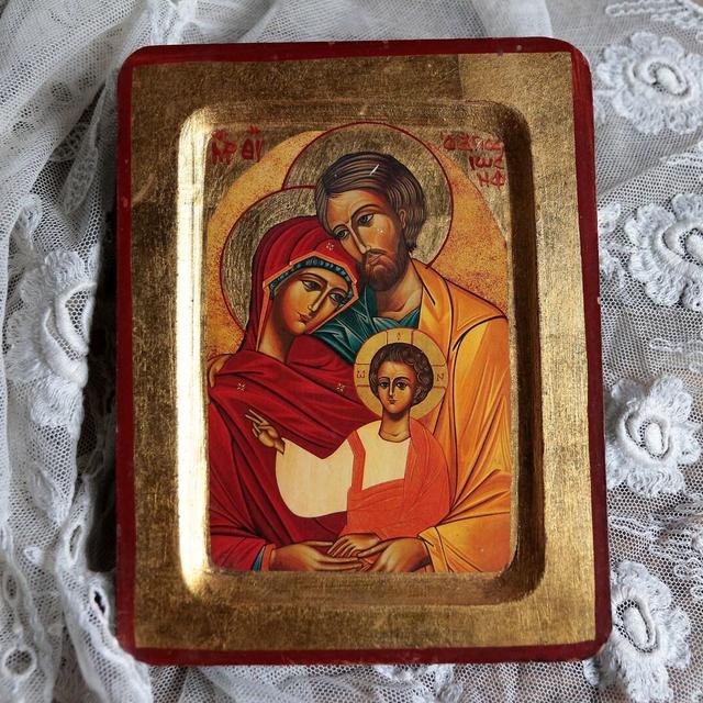 Vintage gilded wood Greek icon. Byzantine icon. Eastern Orthodox icon. Holy family Jesus, Mary and Joseph.