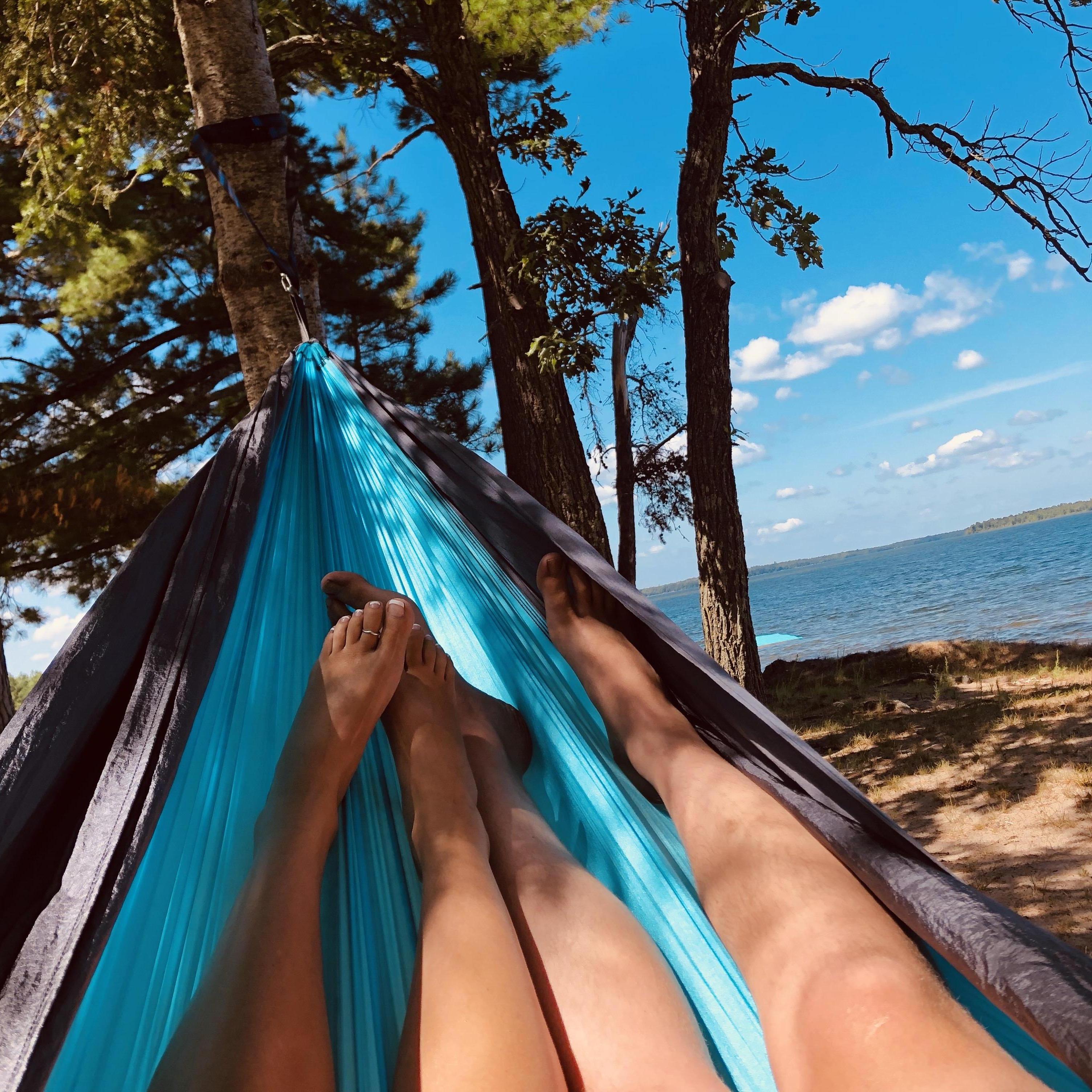 Laying in a hammock on vacation at Cass Lake, MN