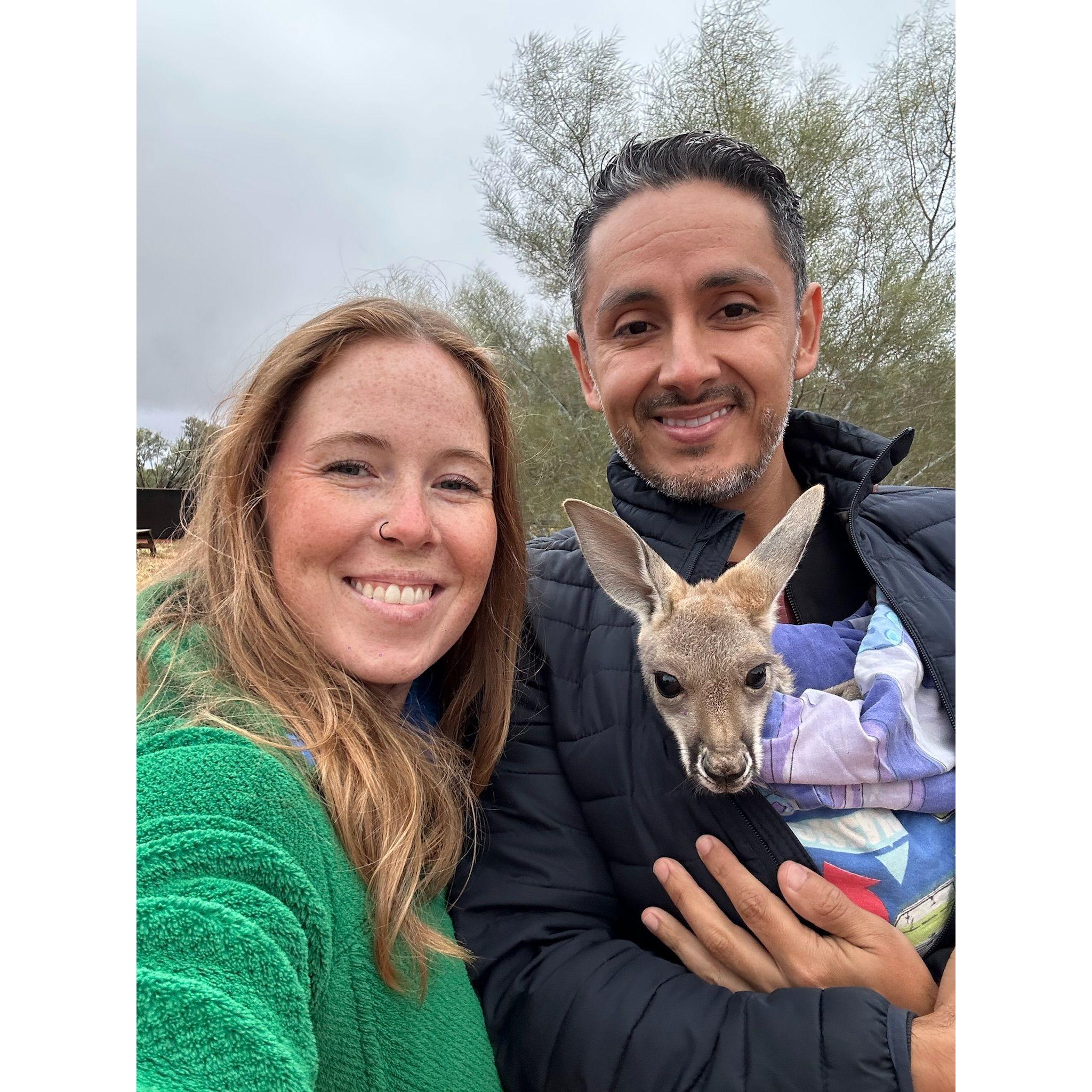 Holding baby joeys in Alice Springs, Australia