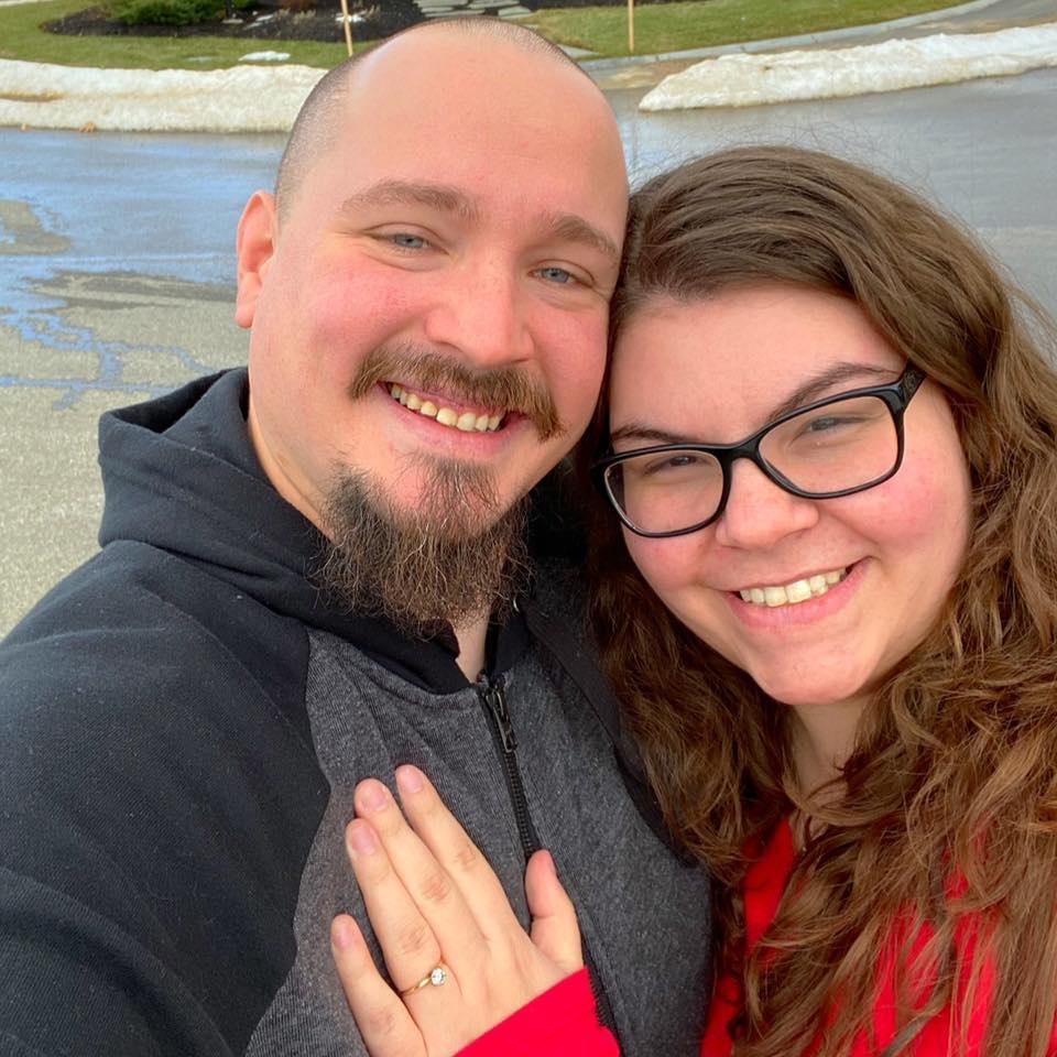 First picture after being engaged! Spot the venue sign in the background!
