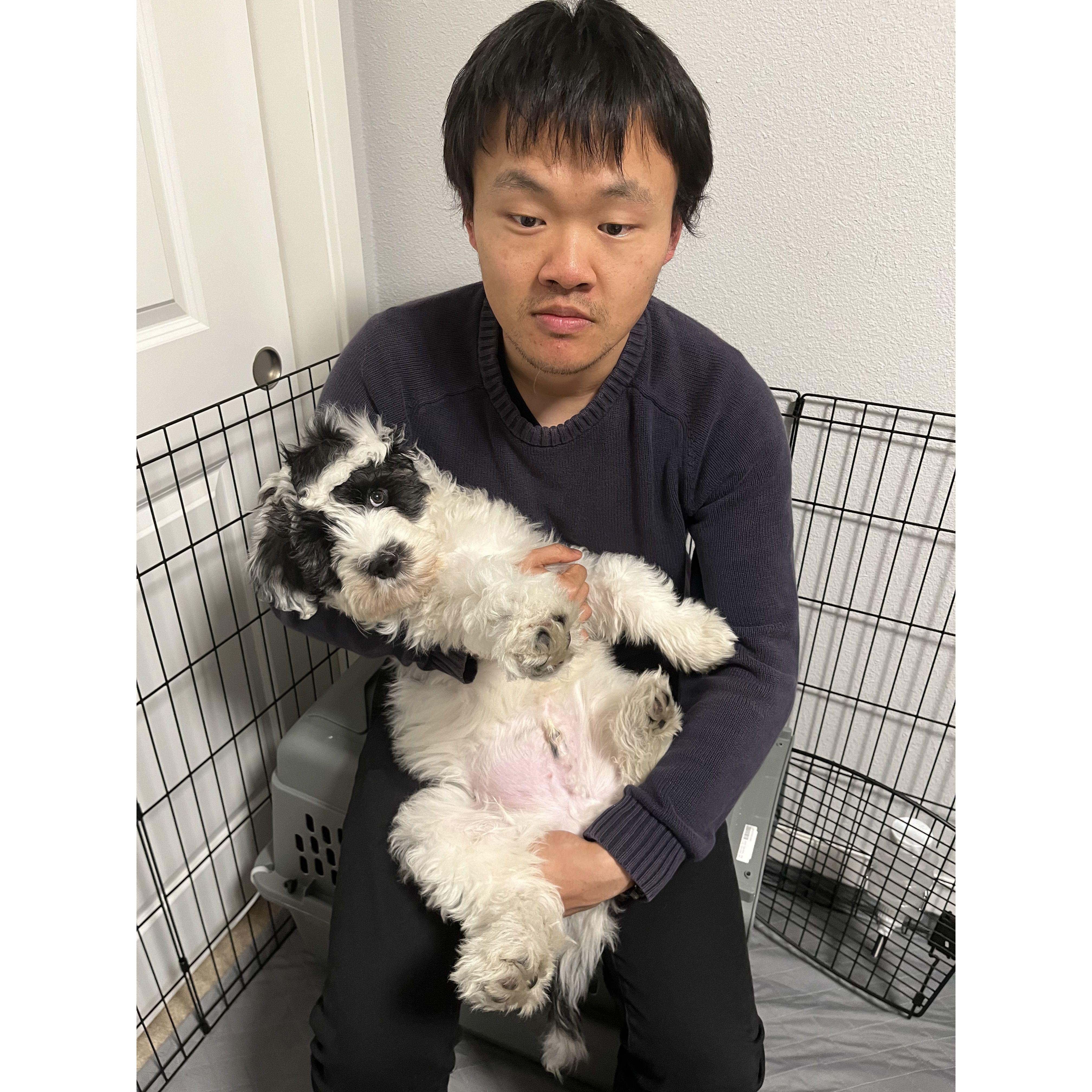 Exhausted daddy with his overexcited puppy.