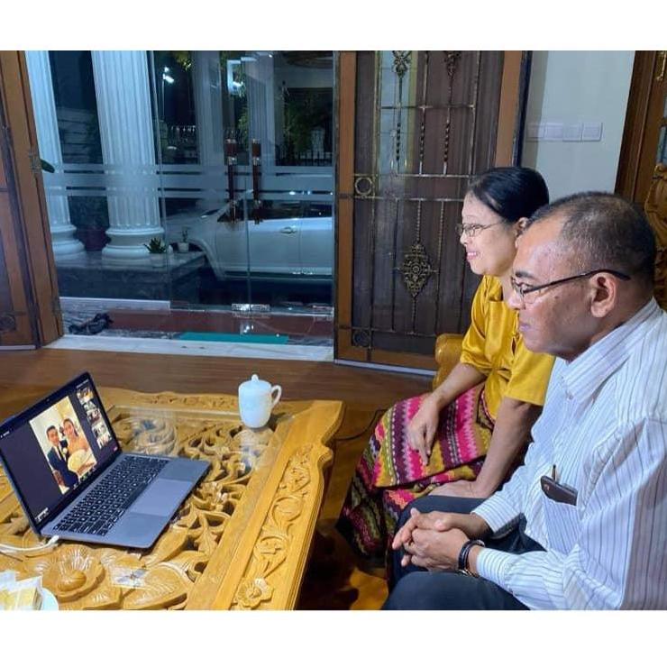Groom's parents in Yangon, Myanmar, attending the wedding via Zoom Video Conferencing.