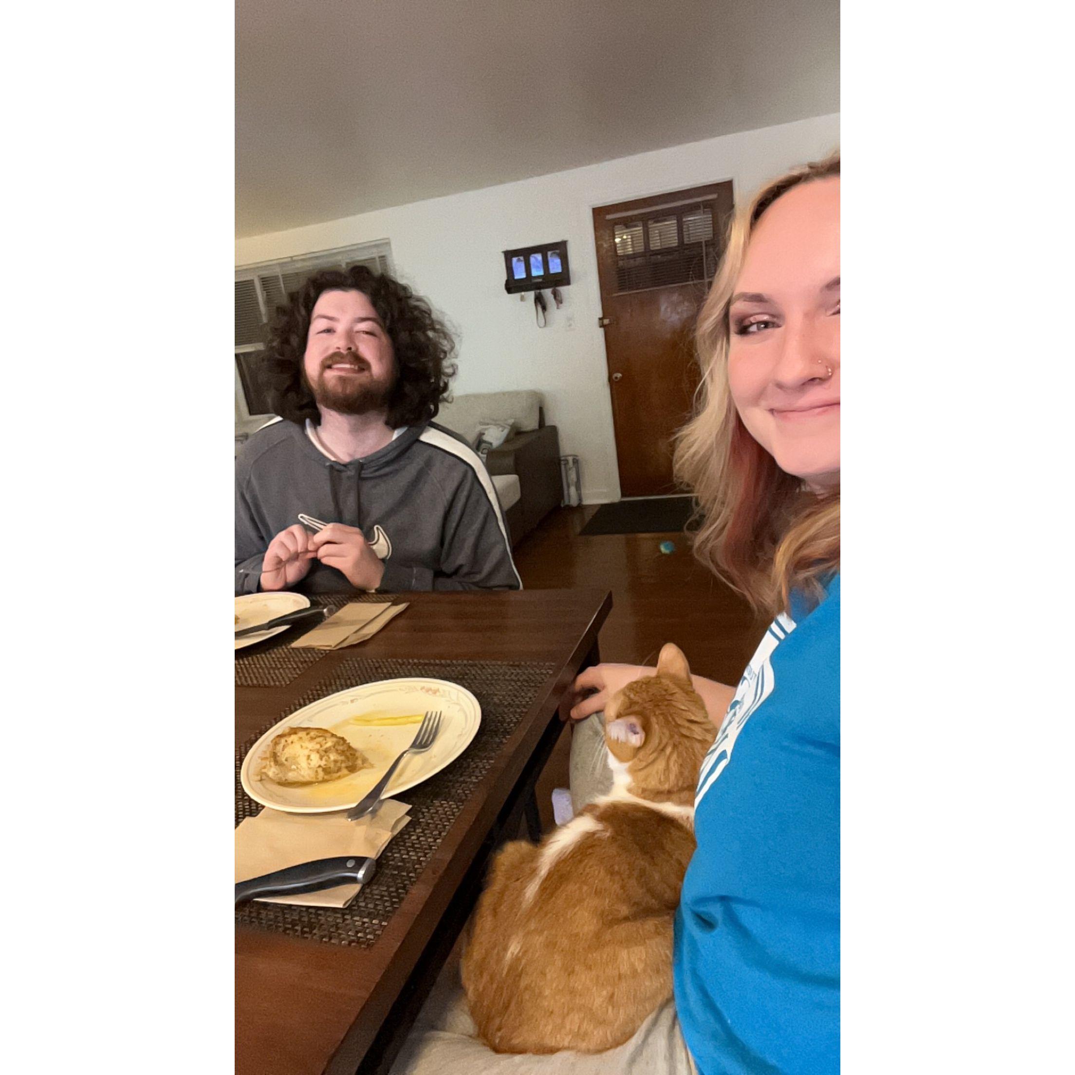 10.14.23 - Skarloey sits on Zoe's lap during a meal (16/17)