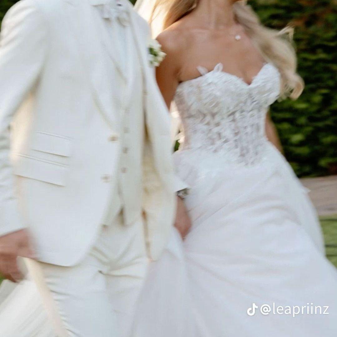 Mariana and Zach will both be wearing white/ivory