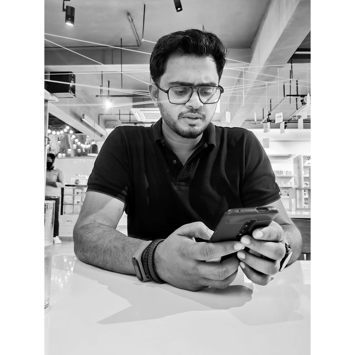 Oshin: The first photograph I clicked of Justin. I still wonder if the face was because of me photographing him or some weird text.