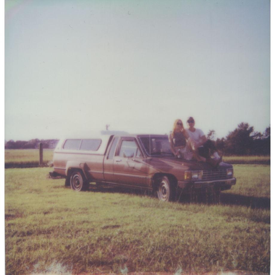 Caroline & Adam, with their truck 'Penny' on the marsh at DeBordieu, SC