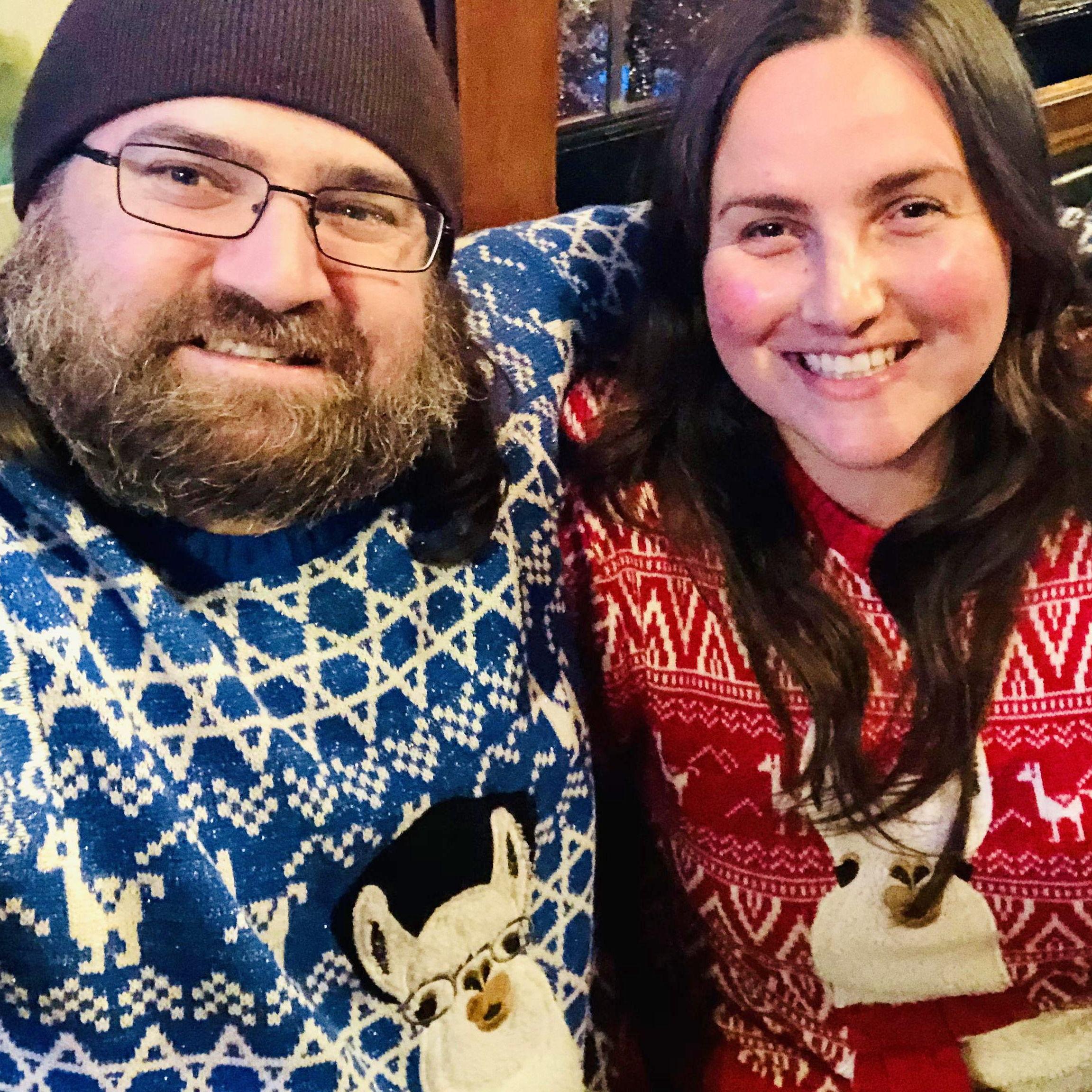 Matching Hanukkah and Christmas llama sweaters for an ugly sweater party, December 2021.