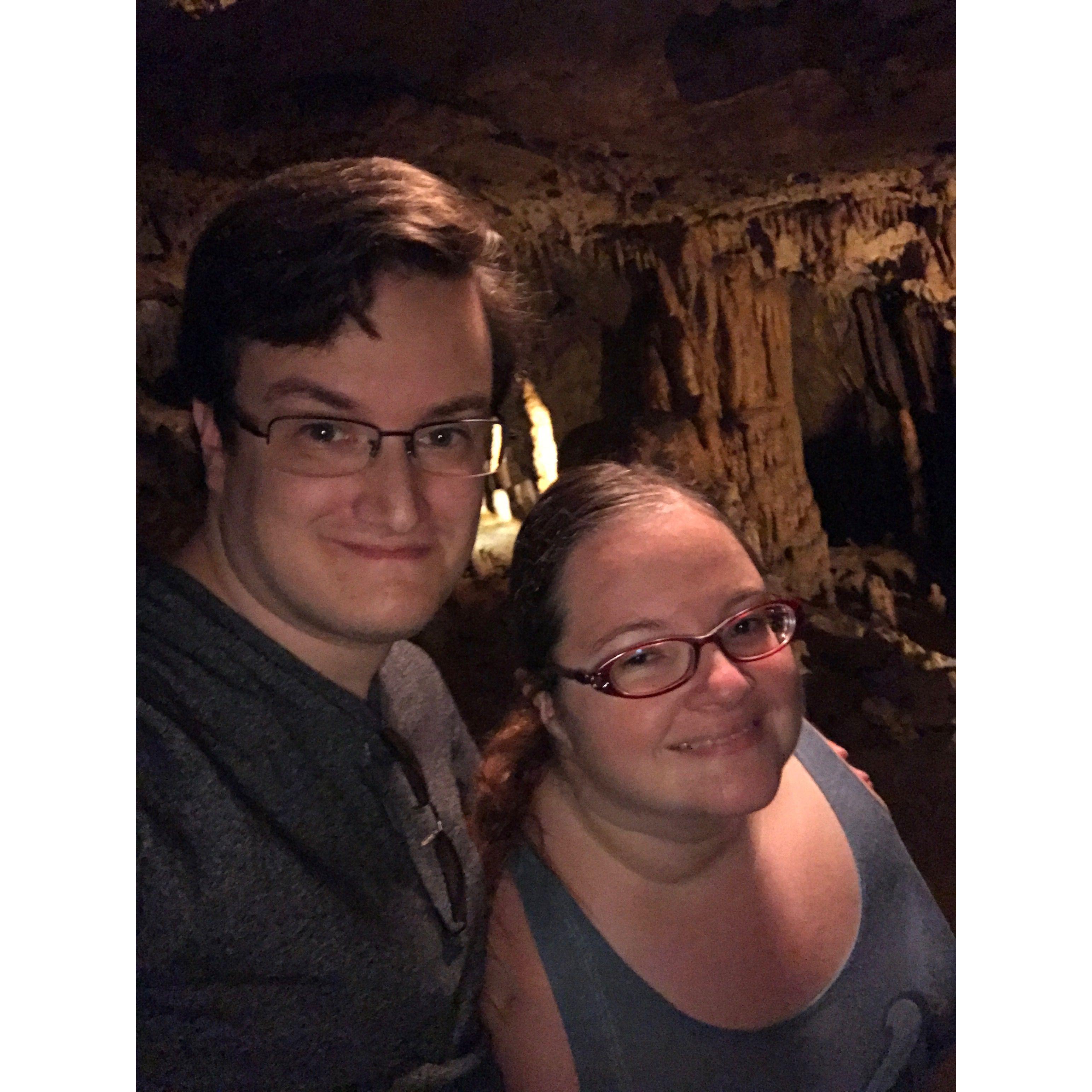 The couple smiling in a cave at FL Caverns State Park.