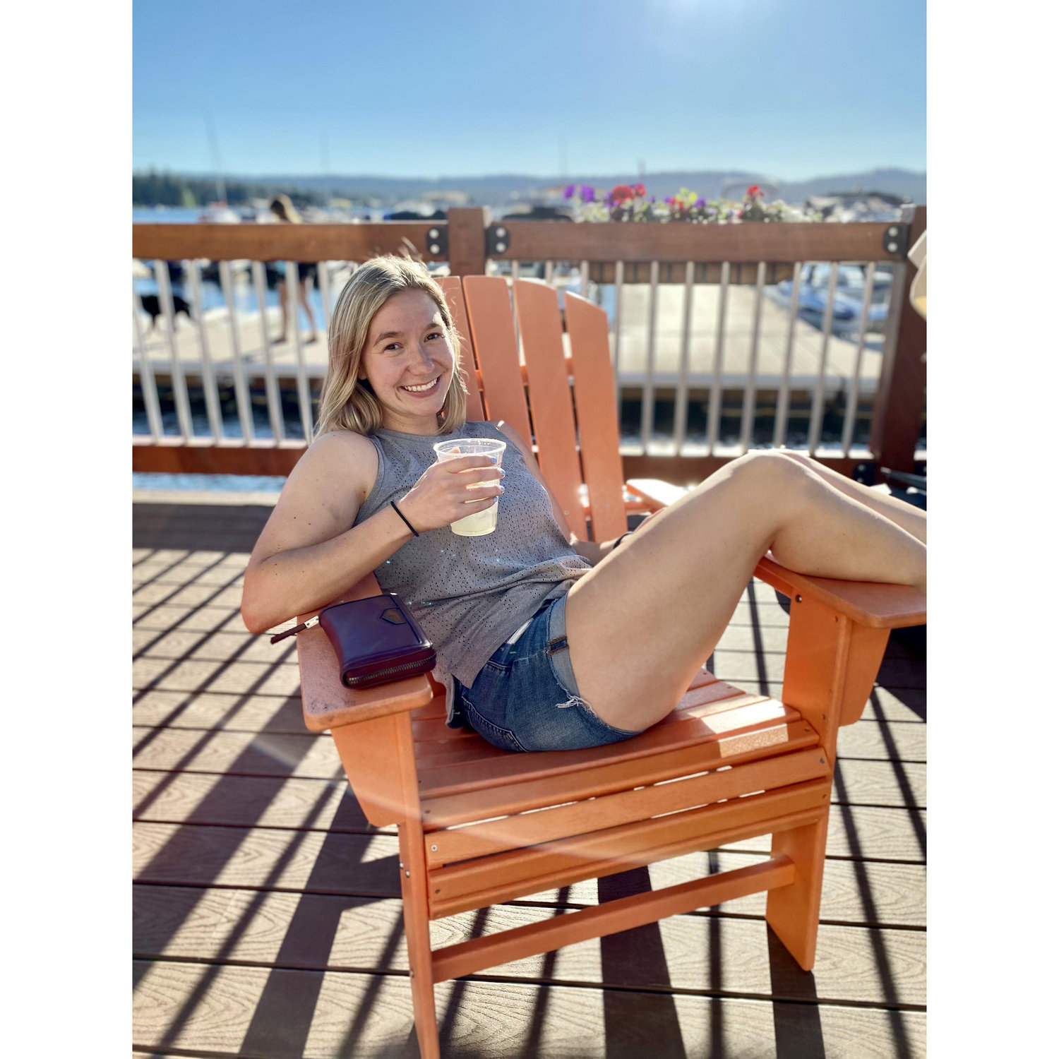 Allie's favorite place to be --- lounging in the sun near the water with a drink in her hand!