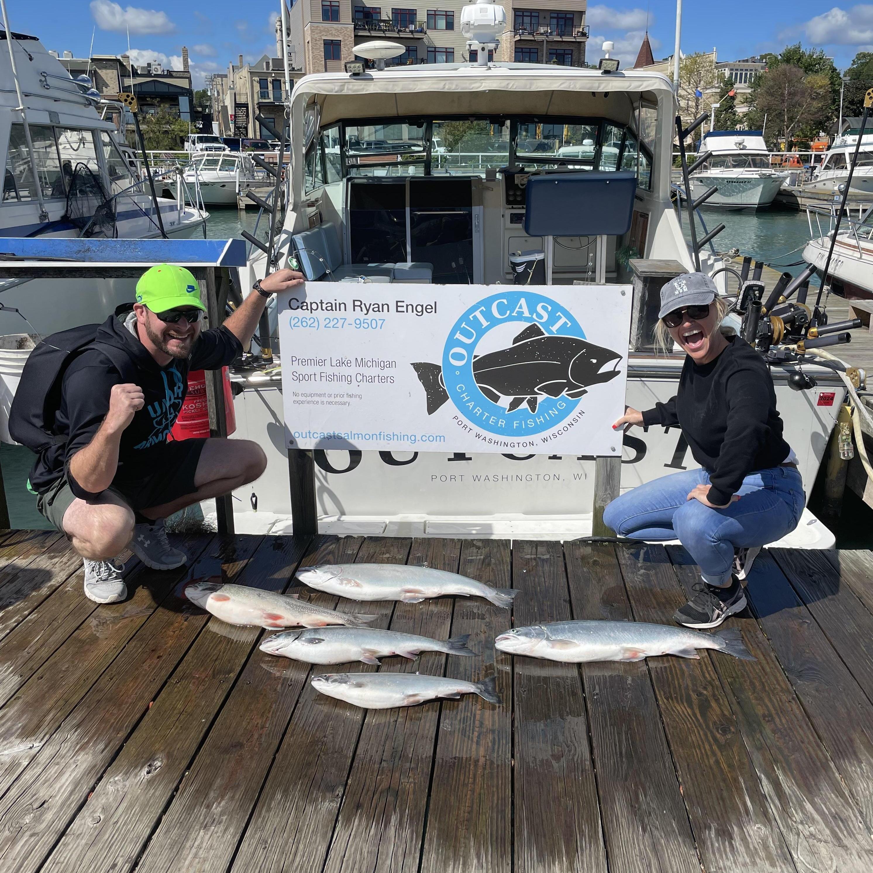 Showing off their catch after a fishing expedition!