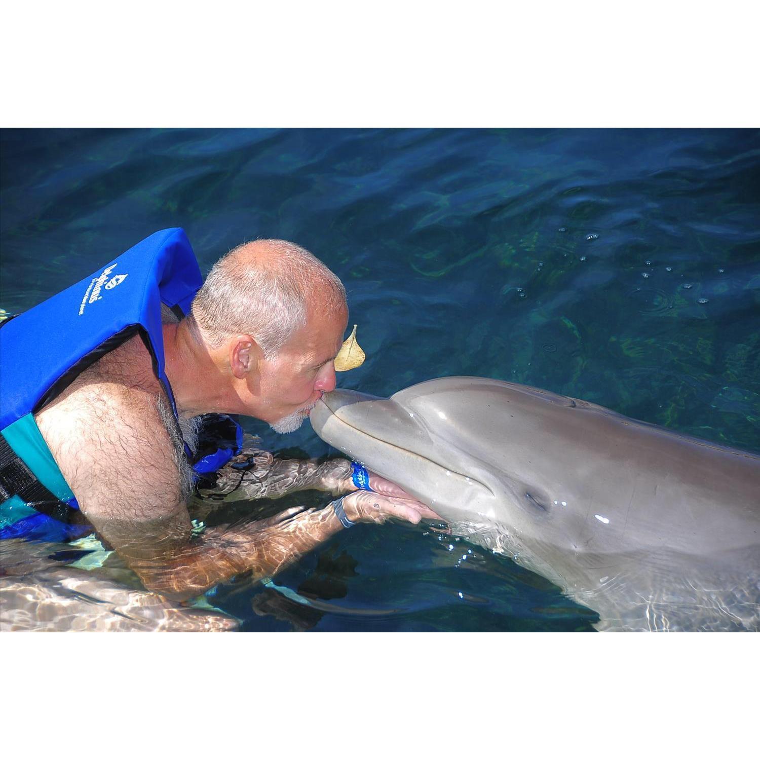 The only thing better than getting a dolphin kiss is to get a doggie kiss....