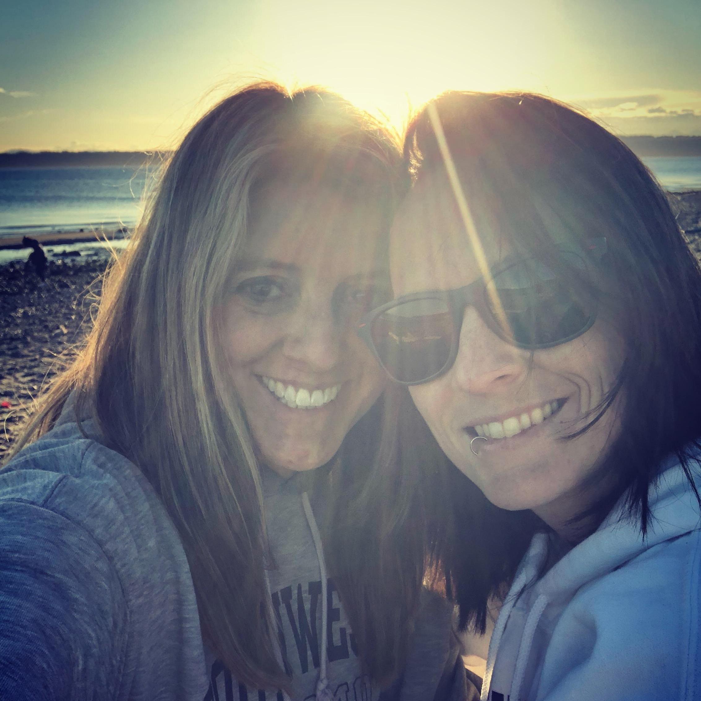 In Seattle watching the sunset on a beach on our first vacation together!