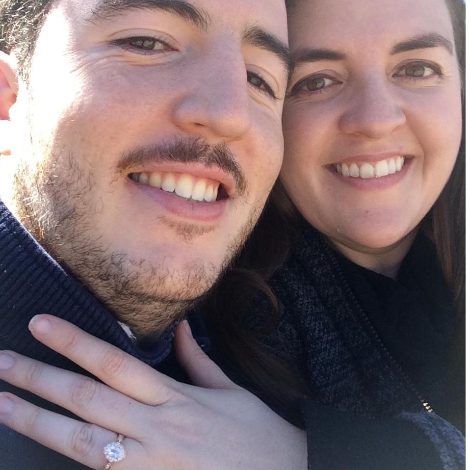 Showing off the ring for friends and family