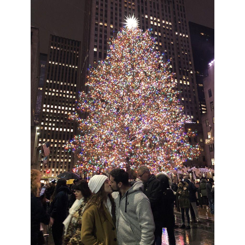 December 2019: A kiss in front of the Rockefeller Tree - New York, New York.