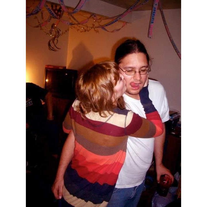 This photo is ten years old. We threw a party at our ho use, and I think it might be our first picture together.