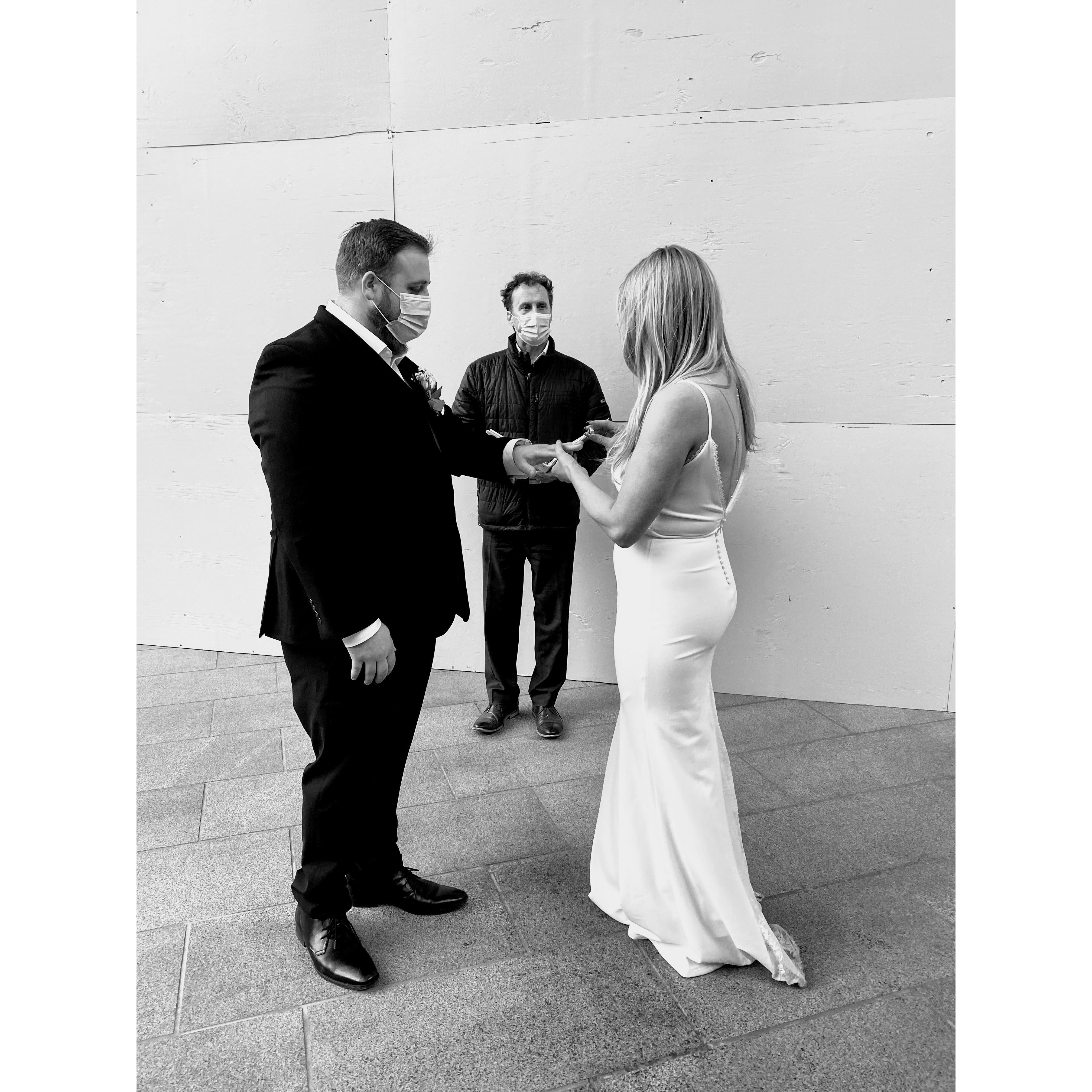 Exchanging vows and rings at the Multnomah County Courthouse in Portland, OR.