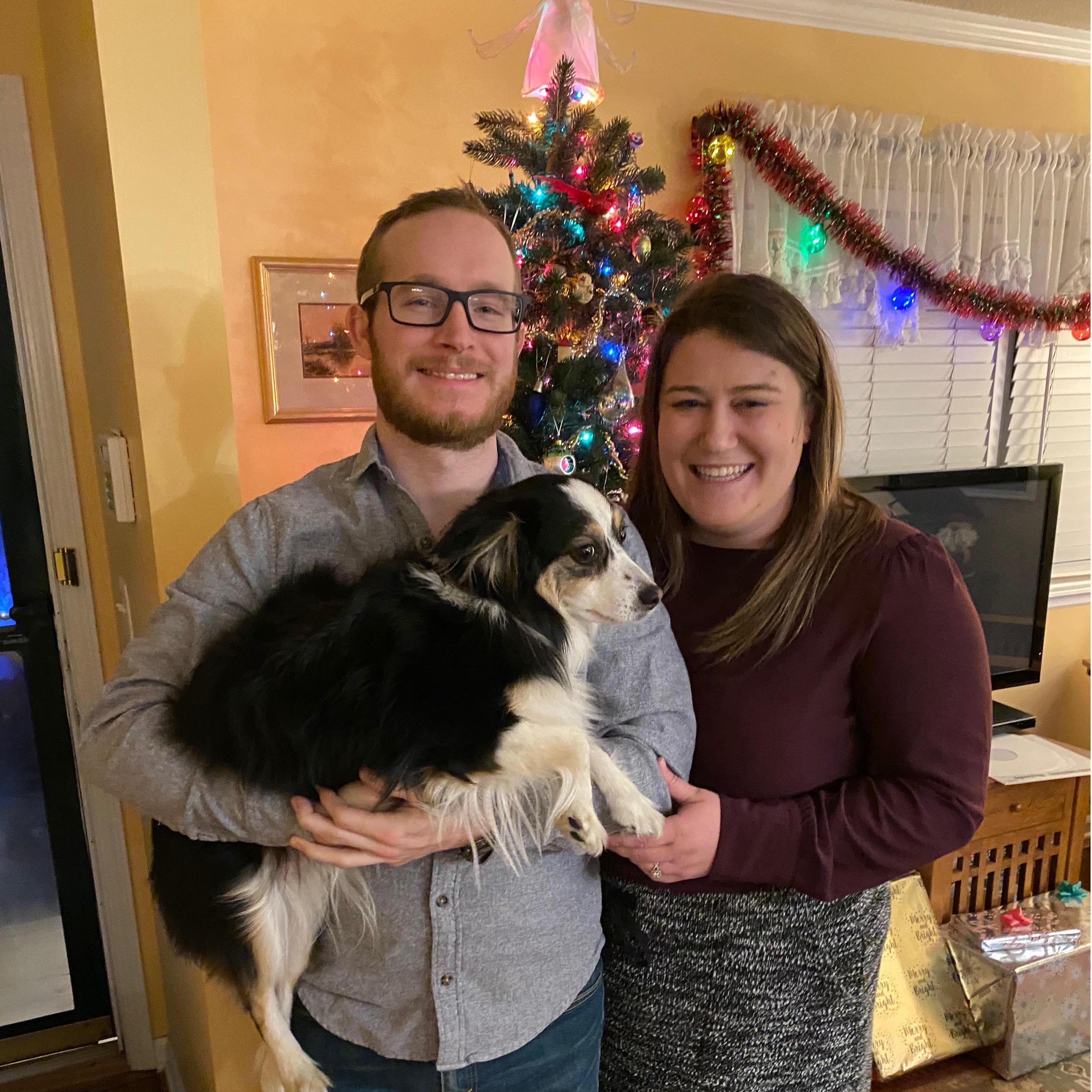 Bella being super happy to be included in the couple photo.