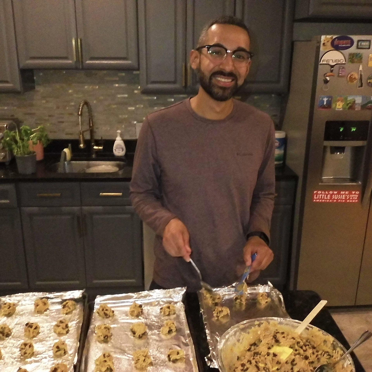 Salomon helping make cookies for Paige's 11th grade class.
