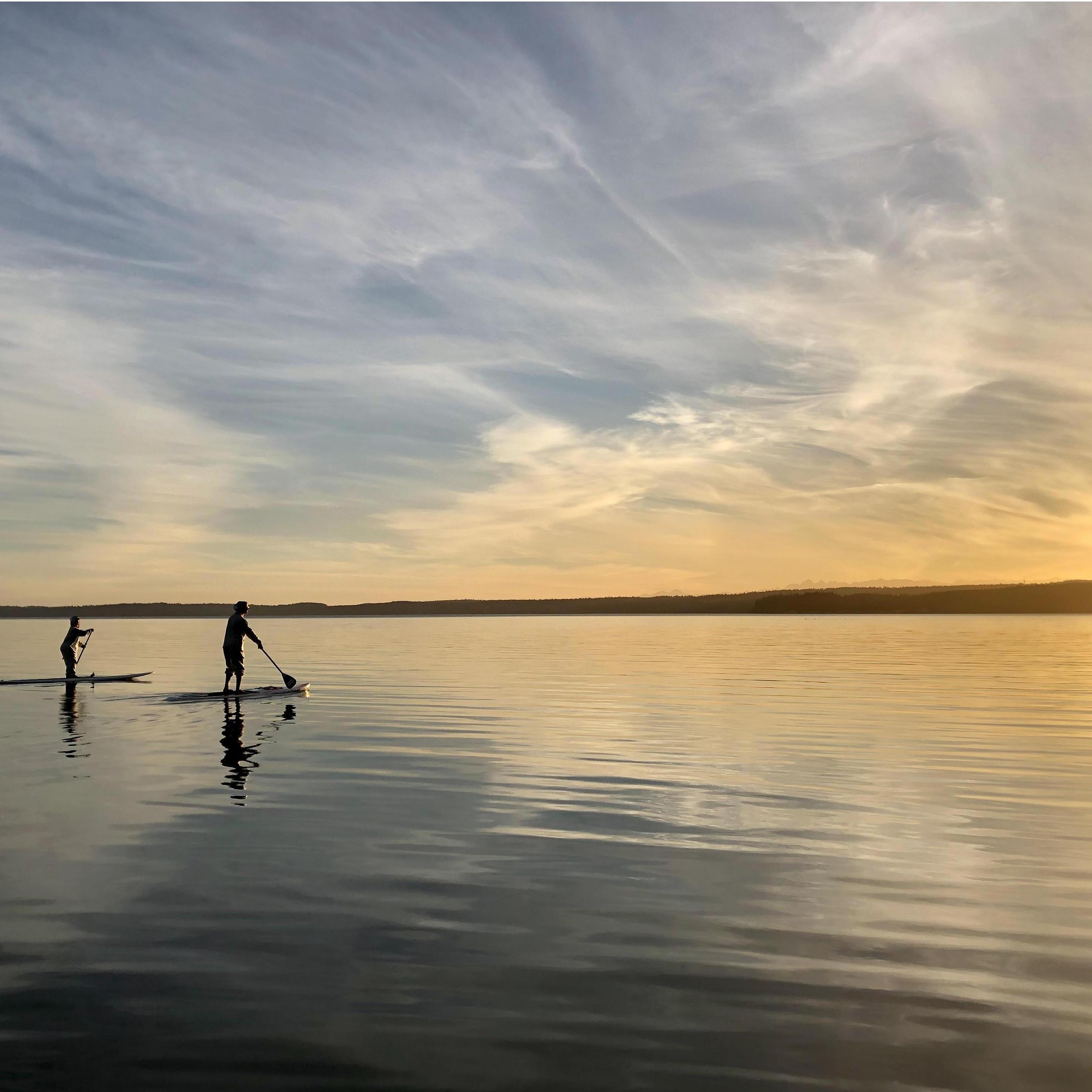 Tommy & Tina paddle boarding at Juniper Beach on Camano Island