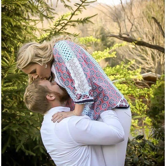 Kisses on the forehead. Sidney's graduation photos, April 2018.