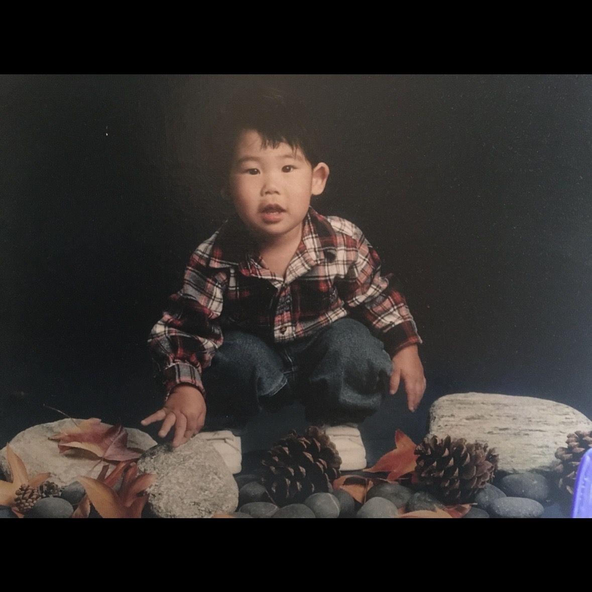 Mini Mitchell with rocks, leaves, and pinecones (things he would collect as a toddler).