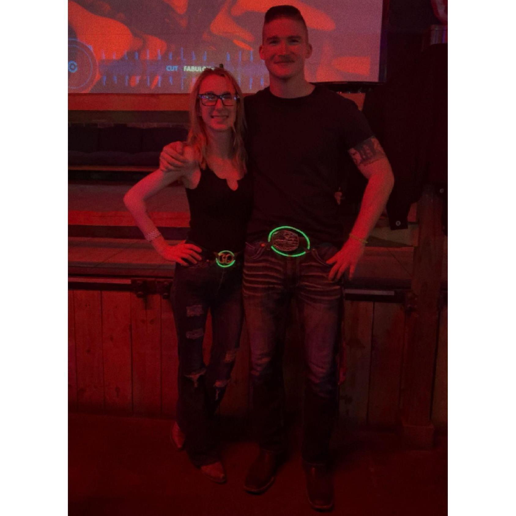 The first night we met. There was a St. Patrick's Day party and a mutual friend brought green glowsticks. We came up with the idea of making a border around our buckles with our glowsticks.