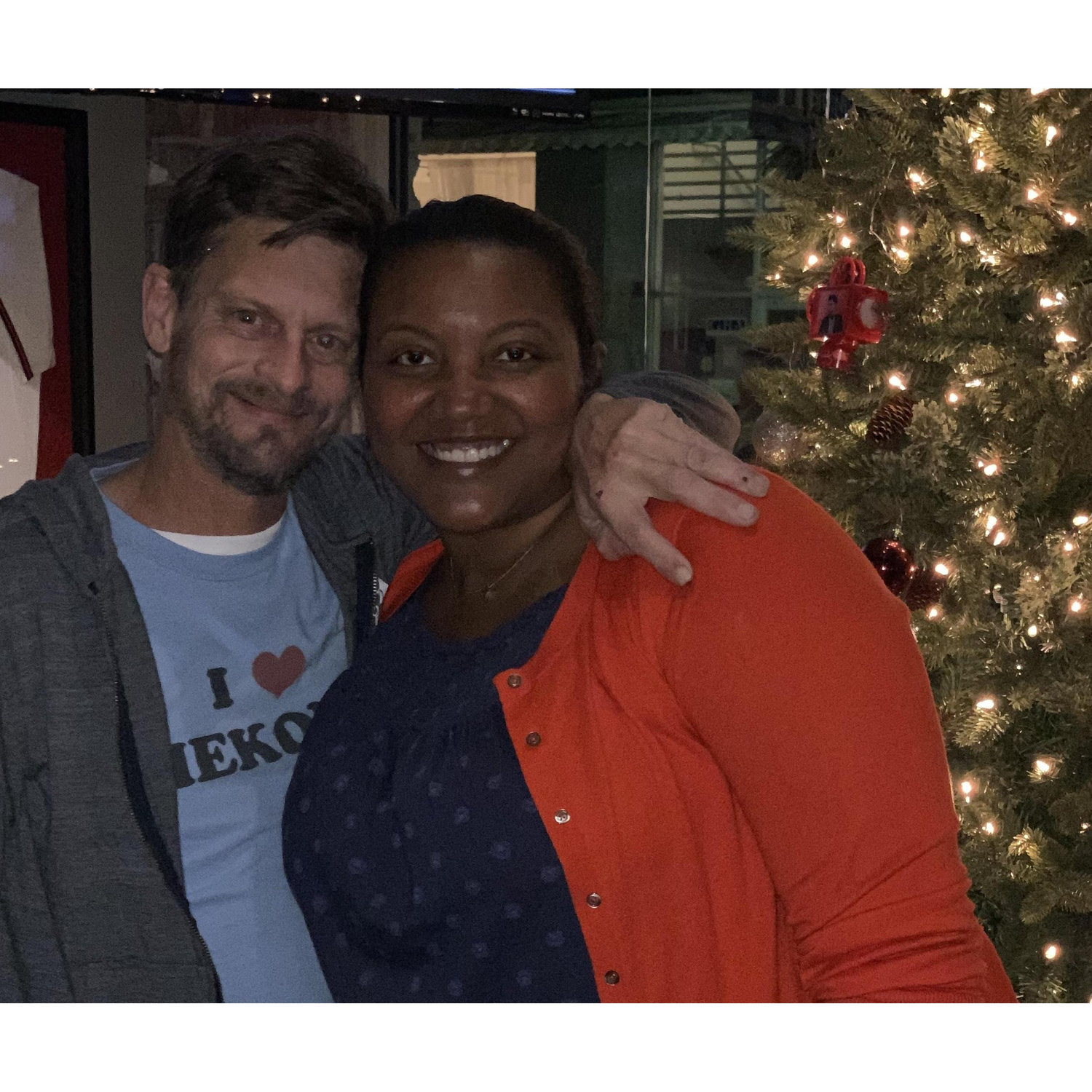 In front of the beautiful Christmas tree at Charleston Beer Works.