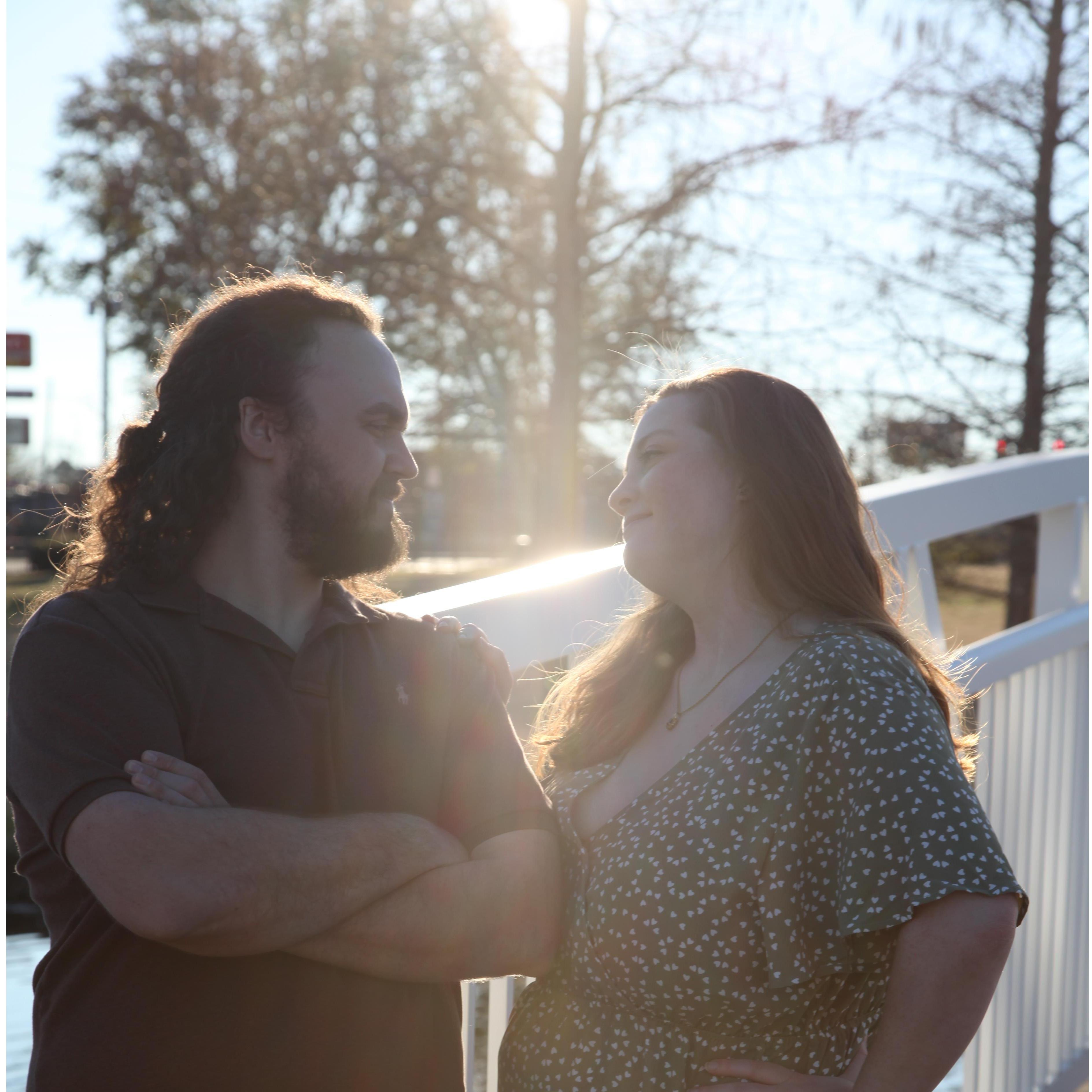 This is me smirking at Logan's puns on the romantic bridge on USM's campus...