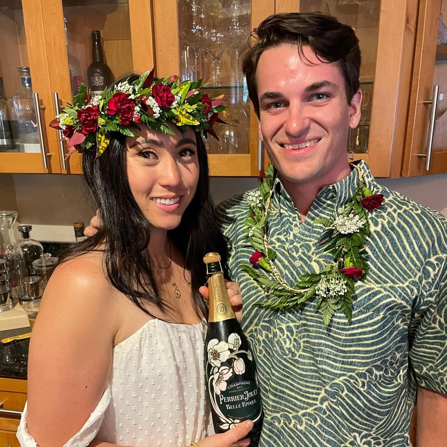 Us looking forward to popping some champagne at our engagement party in Hawai'i last May.