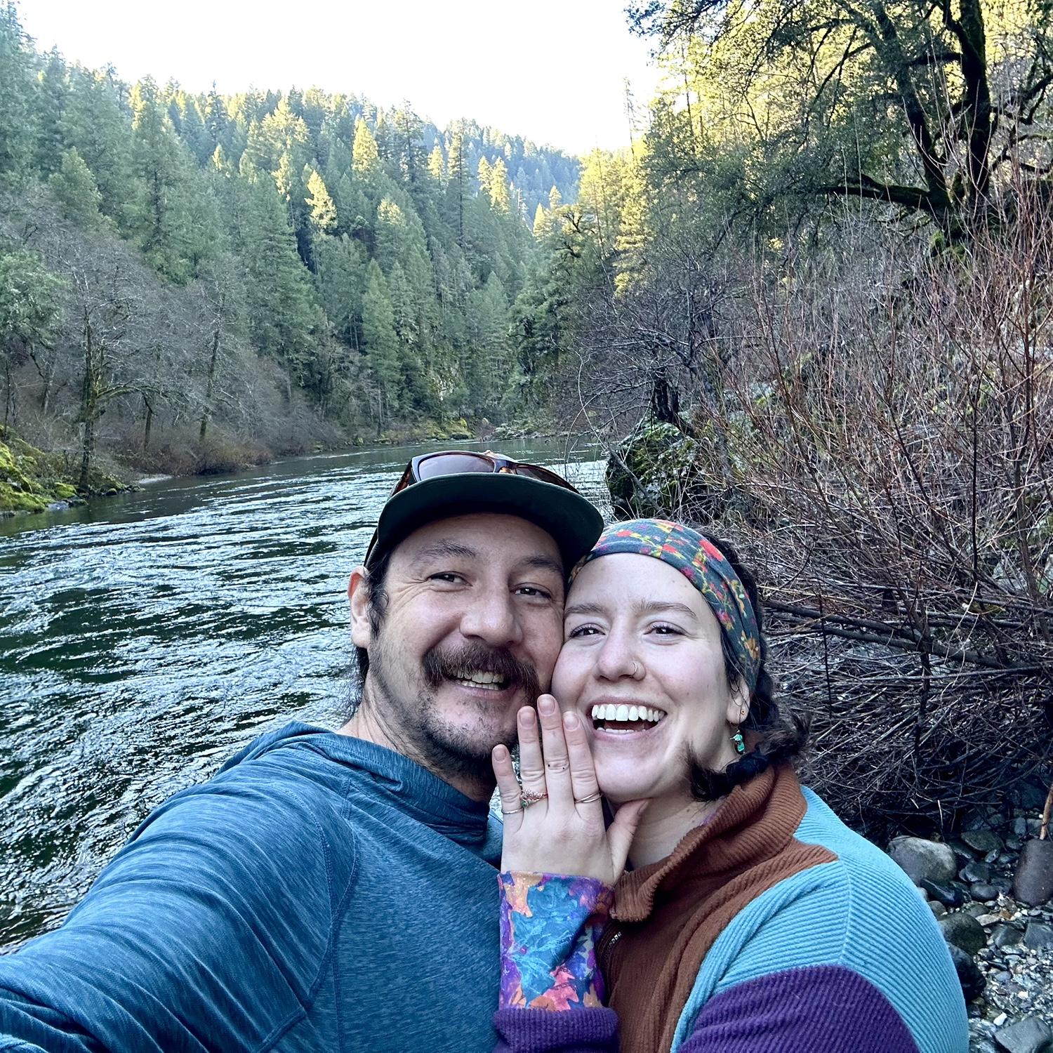 Jesse proposed by the river and Julia said, "yes of course!!"