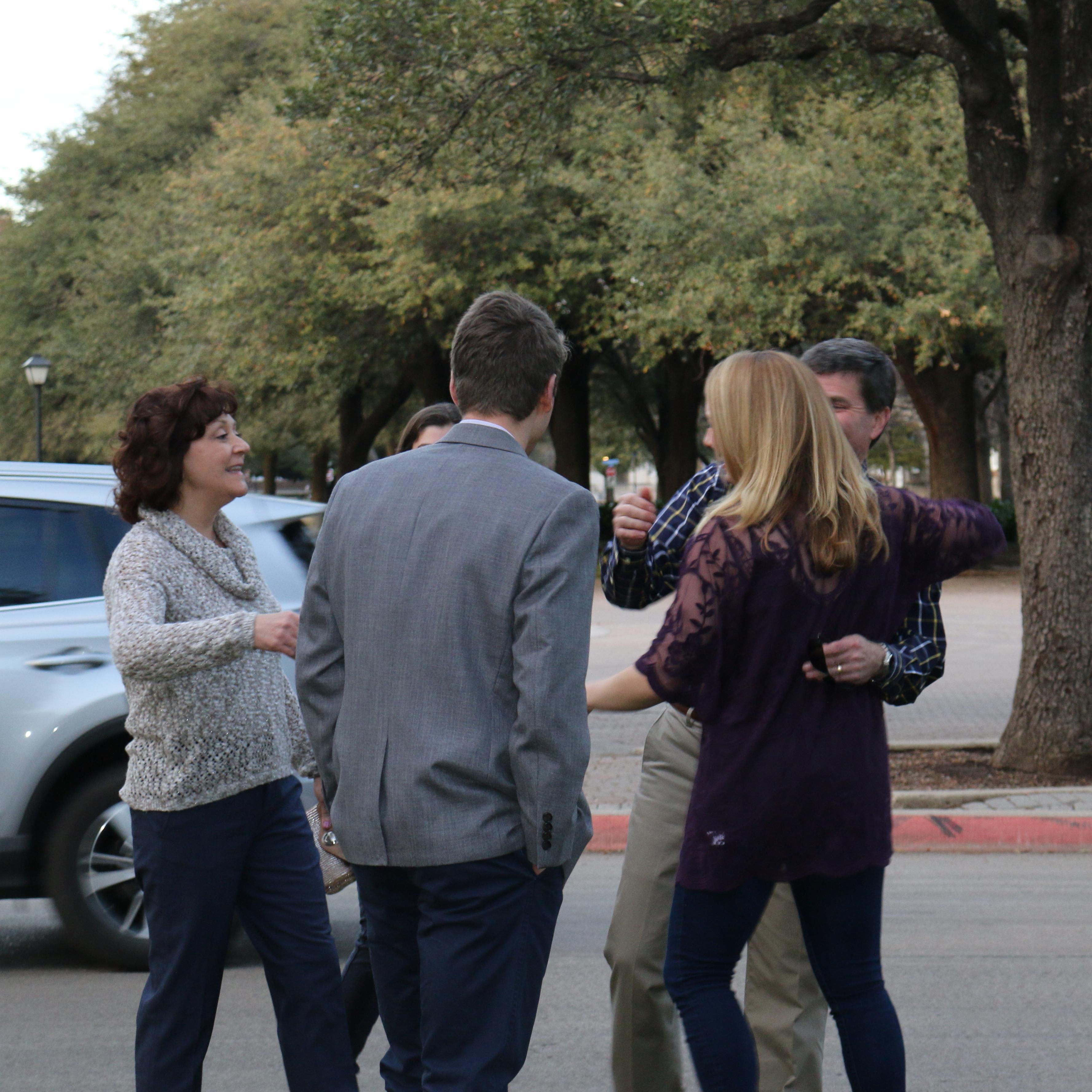 Katie greeting Alex's family after she realizes that they flew all the way down from Pittsburgh for the engagement!