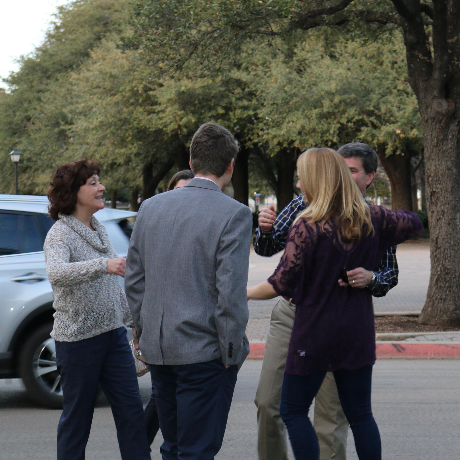 Katie greeting Alex's family after she realizes that they flew all the way down from Pittsburgh for the engagement!