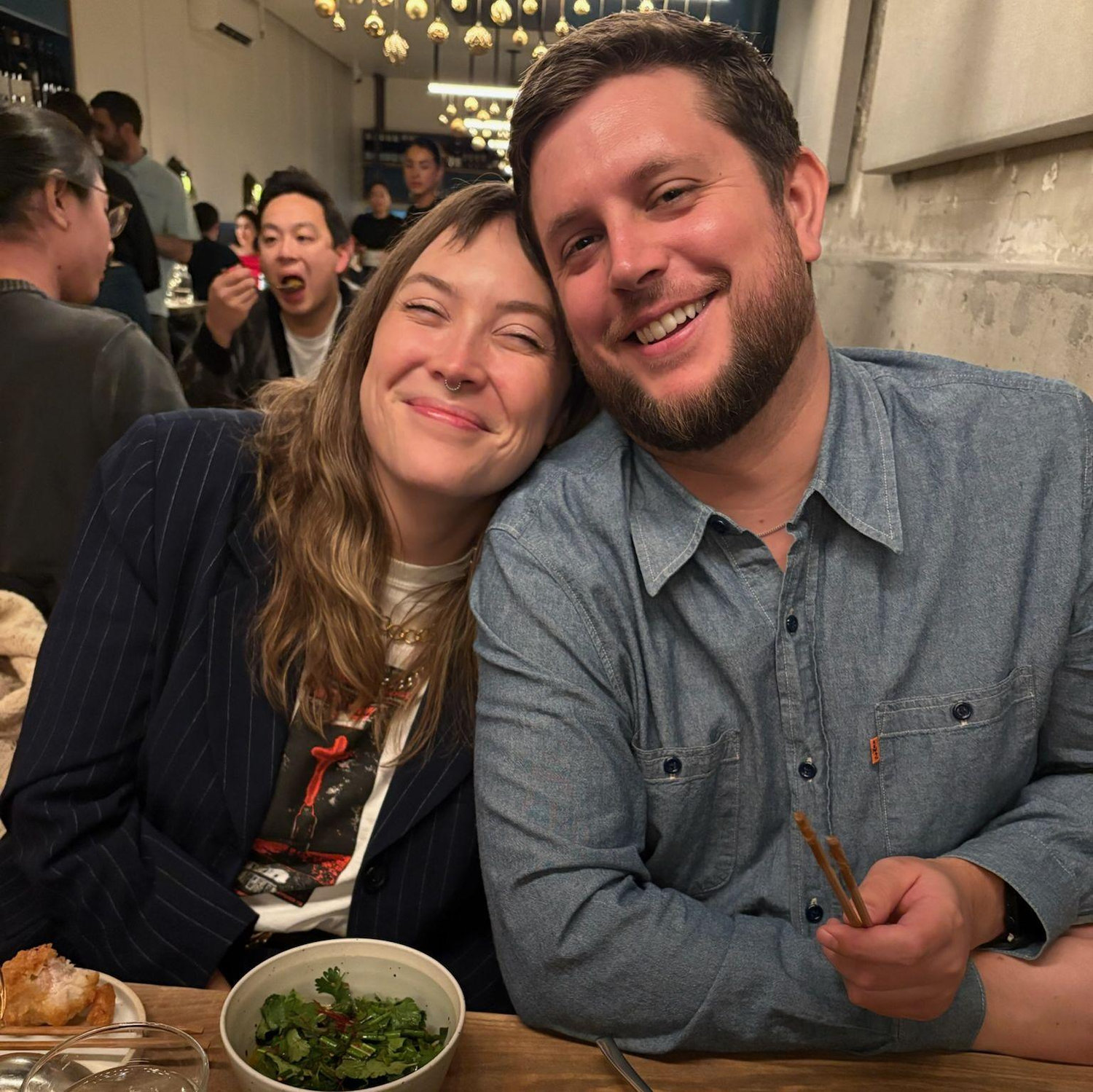 Great food makes us both grin.