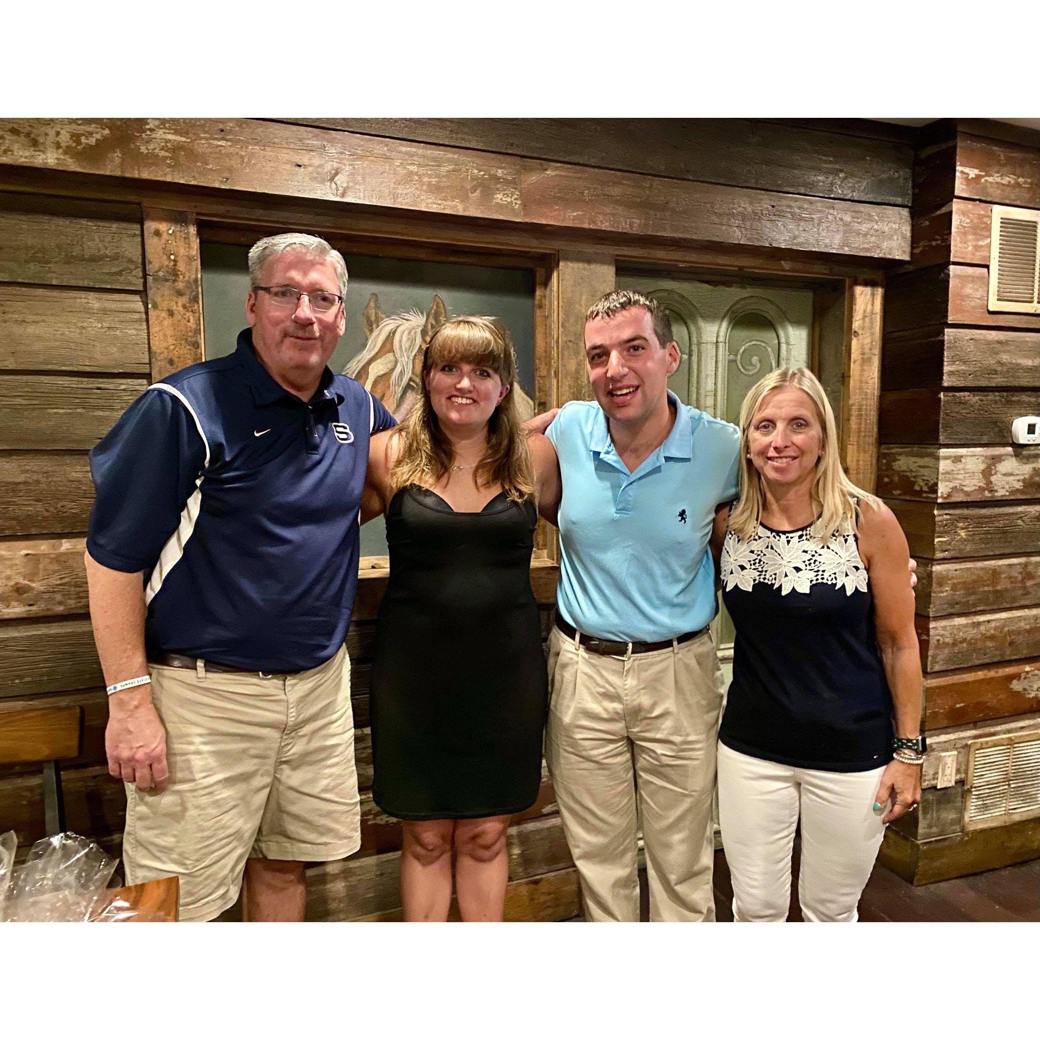 Kelly and Austin at Kelly's college graduation party with Kelly's proud parents Norma and Jack McFarland they are so excited to have Austin as their son in law.