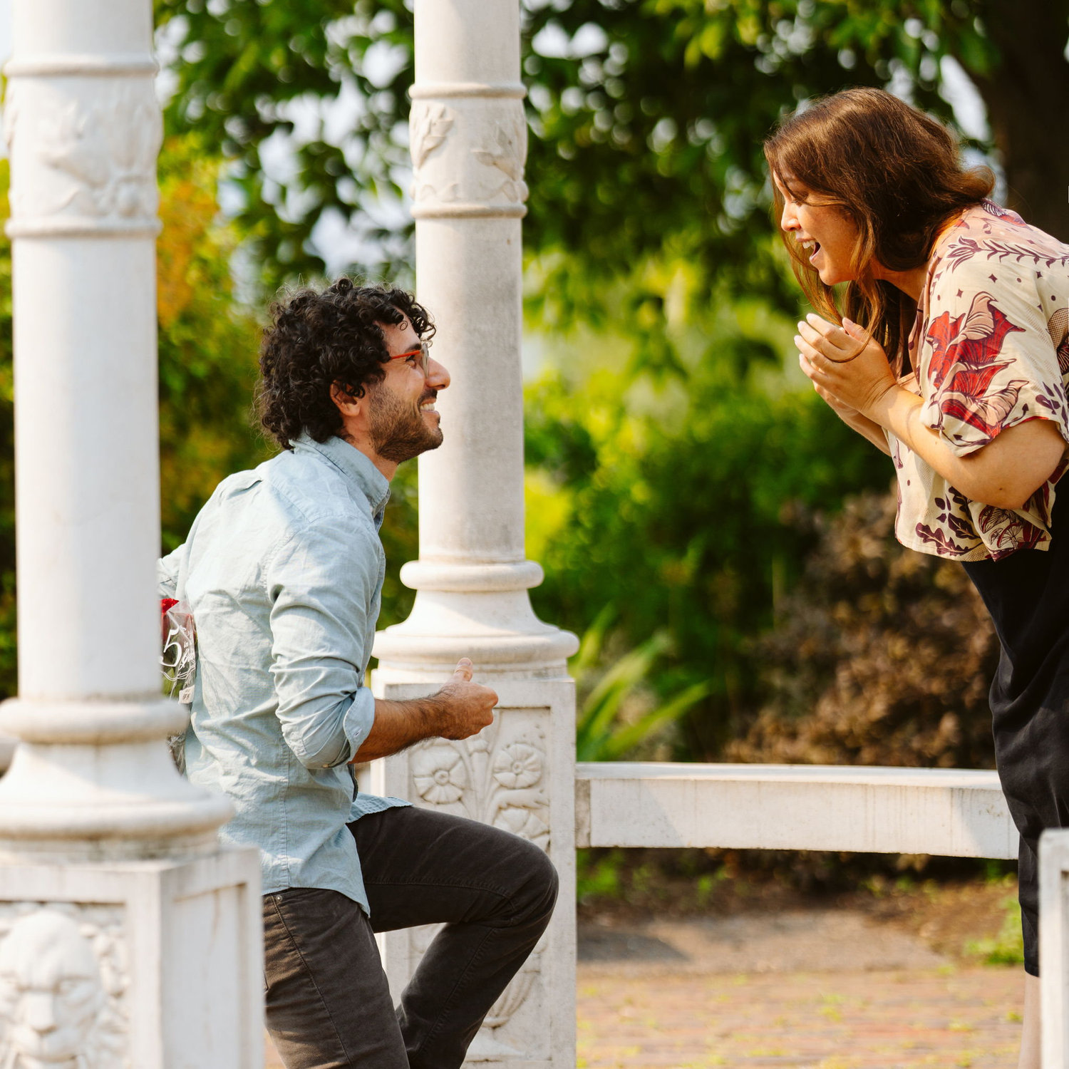 Raffi proposed at the Duluth rose garden on August 1st 2025. Check out the full story on our FAQ page!
