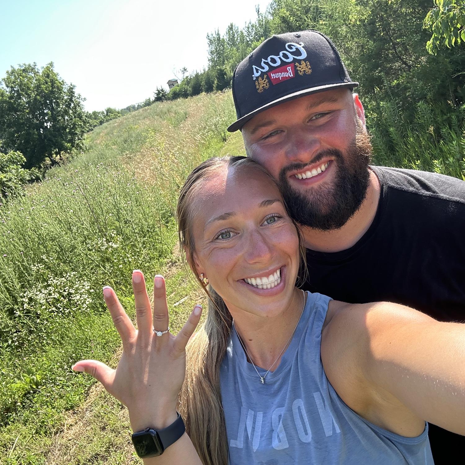 Nick proposed on July 5th, 2025 at his family farm. Nick took us on a morning hike to start the holiday weekend. After a mile of Nick being goofy and us ready for the lake water, he dropped to a knee!