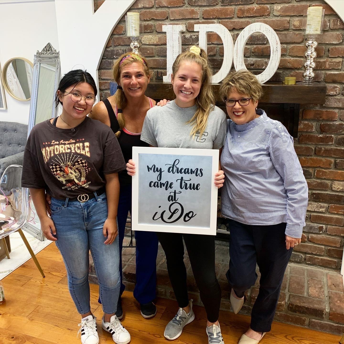 This is a photo from when Hannah picked out her wedding dress during September of 2021 with Hannah's mom, Hannah's sister, Zoe, and James' mom.