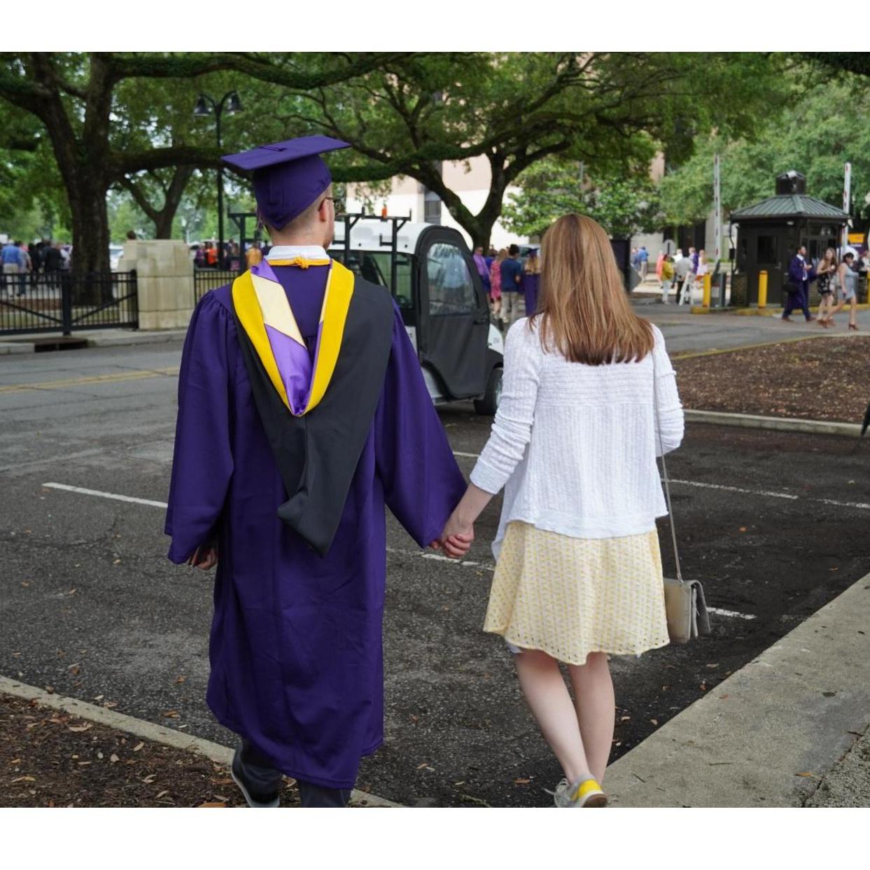 Someone took this photo of us after Drake graduated from the College of Engineering.